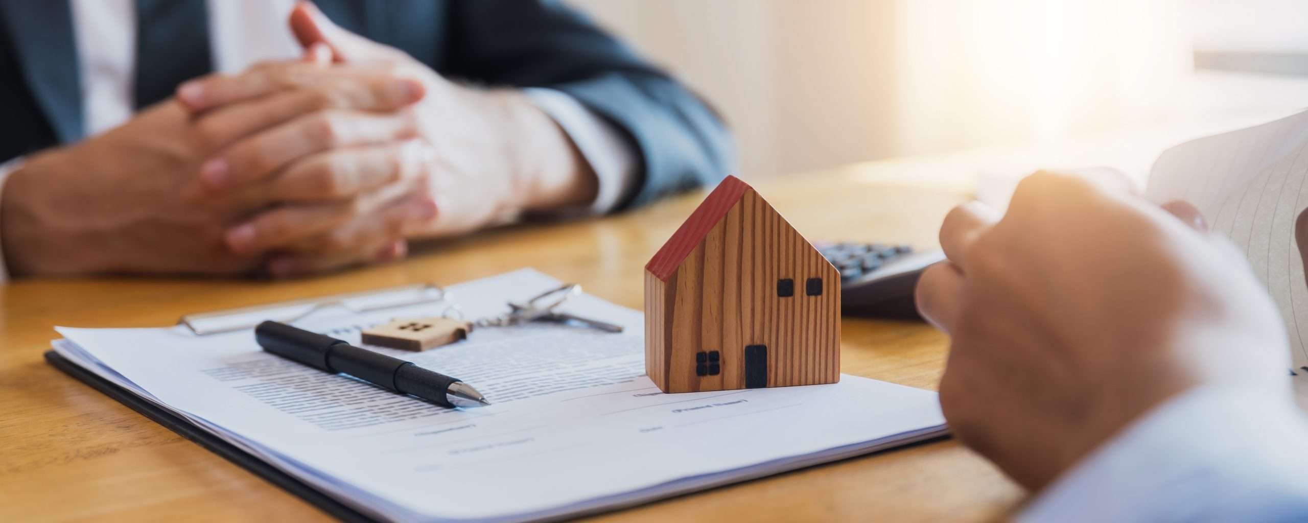Home buyers meet and negotiate with real estate agents about ren